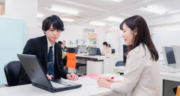 A male staff member at the counter